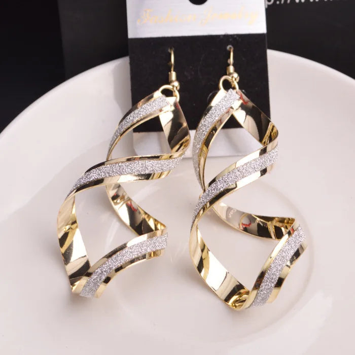 Paradise Divas' stylish punk-inspired metal spiral earrings in gold and silver
