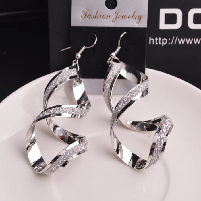 Paradise Divas' stylish punk-inspired metal spiral earrings in gold and silver
